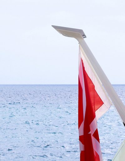 Composite Starlink flagpole mount exposed to marine conditions on yacht