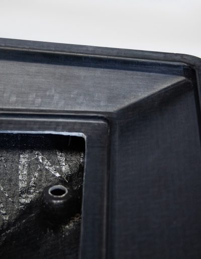 Real-life photo of custom-made Starlink spreader mount with black underside